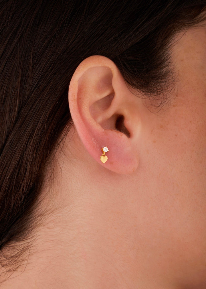 Iris stone with heart gold ear piercing