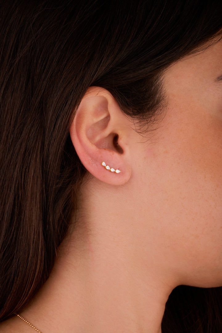 Iris four pairs gold ear piercing