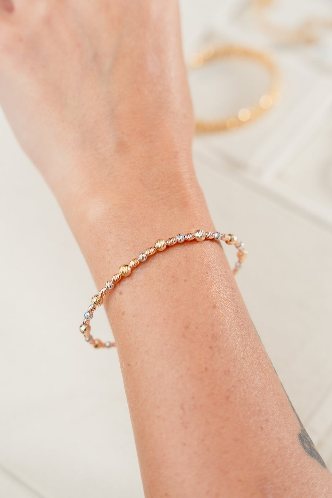 Iris Oval Beads Gold Bangle