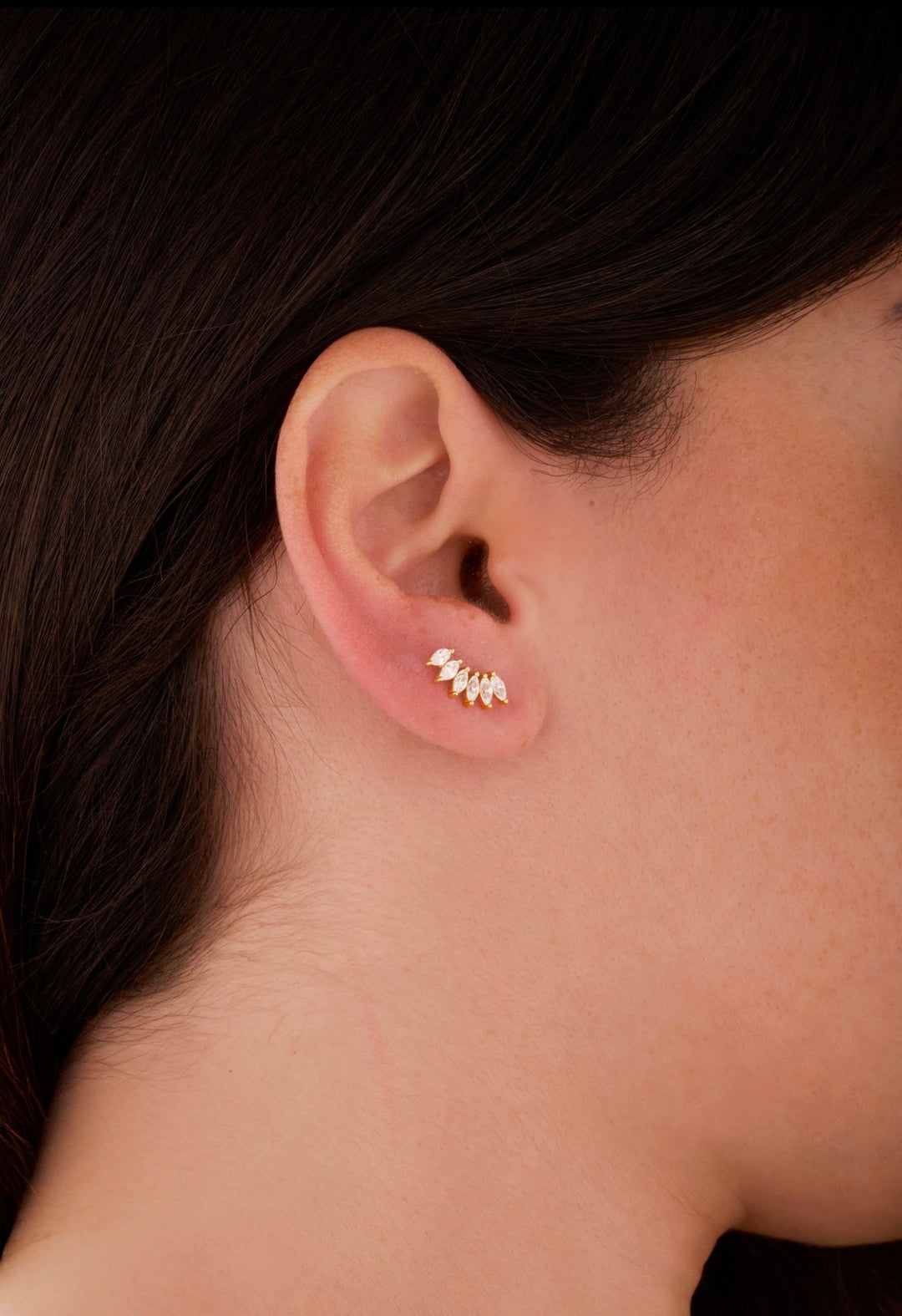 Iris gold ear piercing