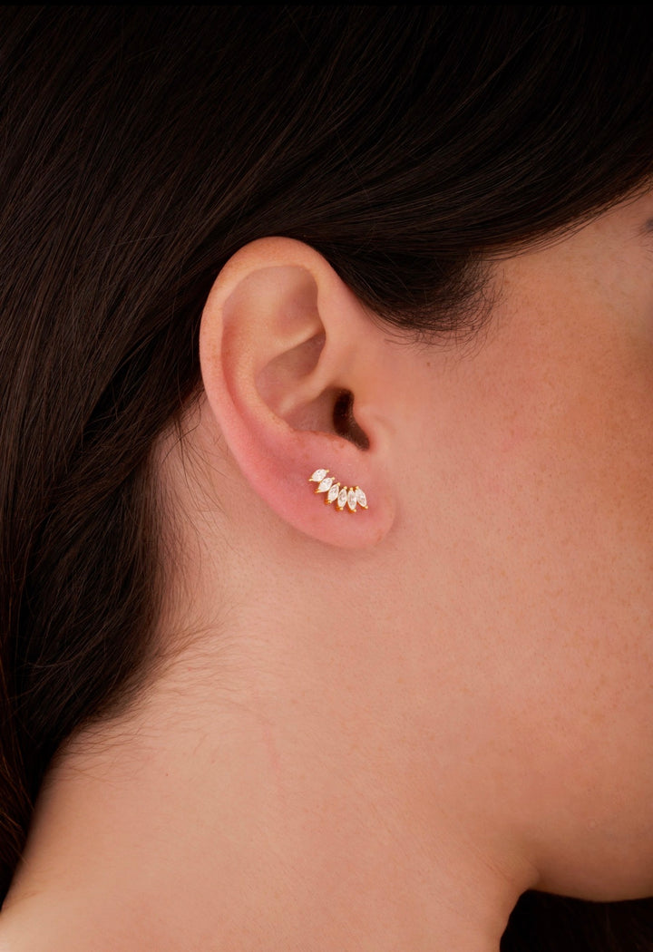 Iris gold ear piercing