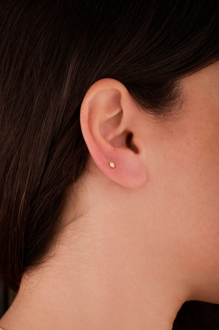 Iris marquise gold ear piercing