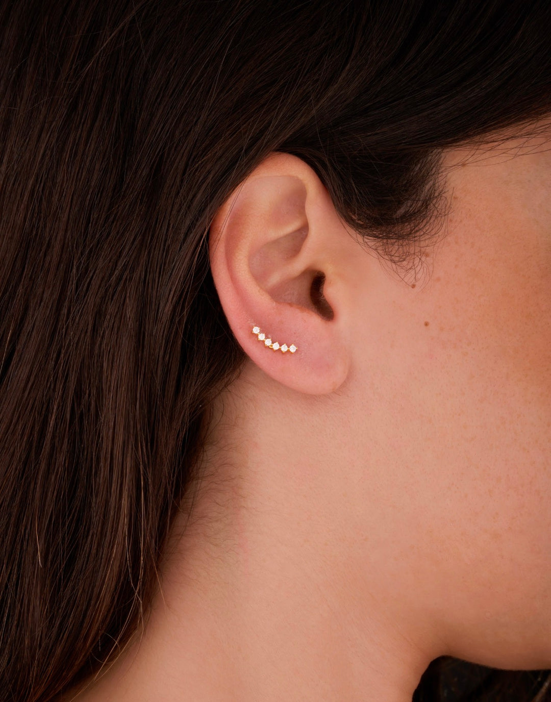 Iris six round gold ear piercing
