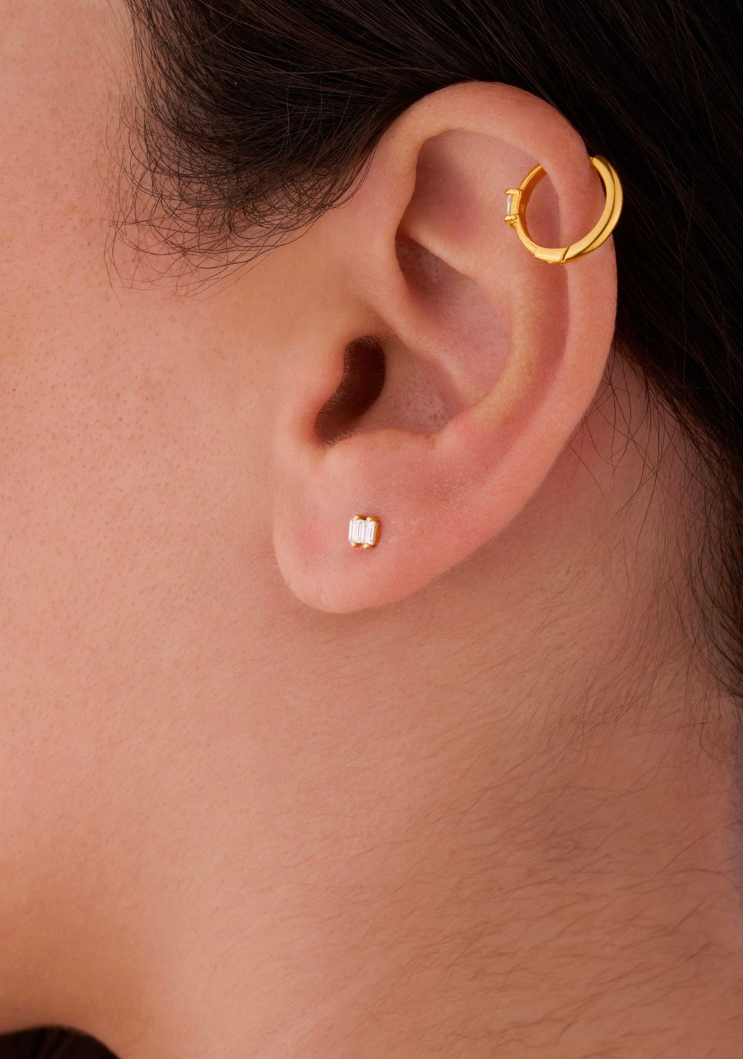 Iris two small rectangles gold ear piercing