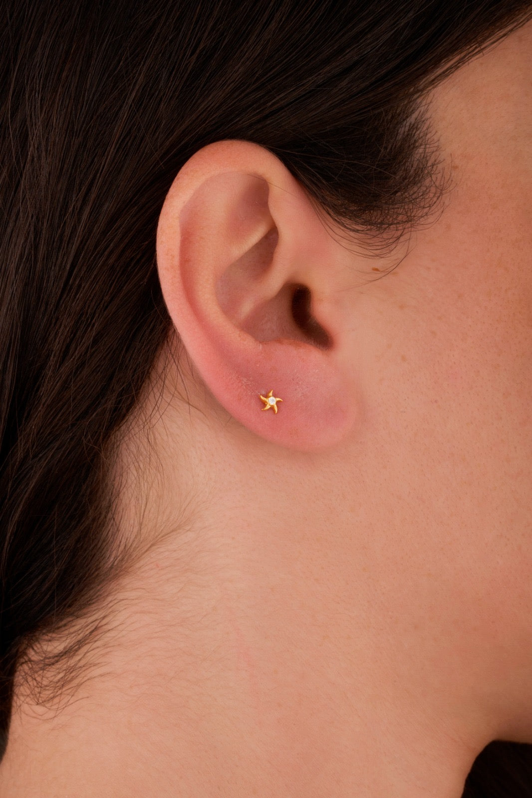 Iris starfish stone gold ear piercing