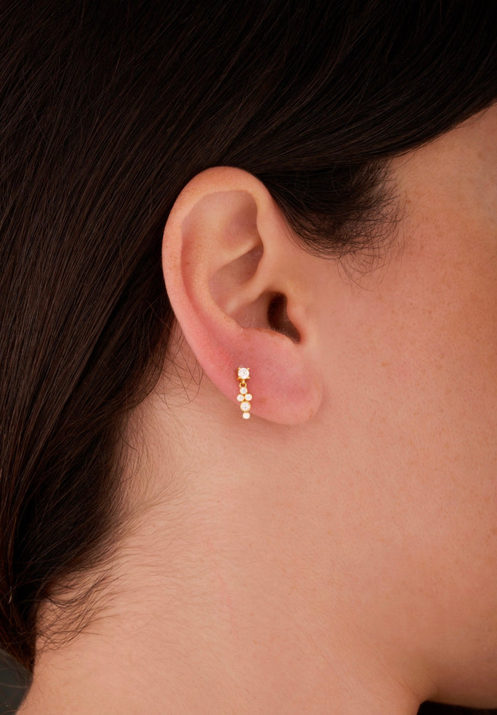 Iris gold ear piercing