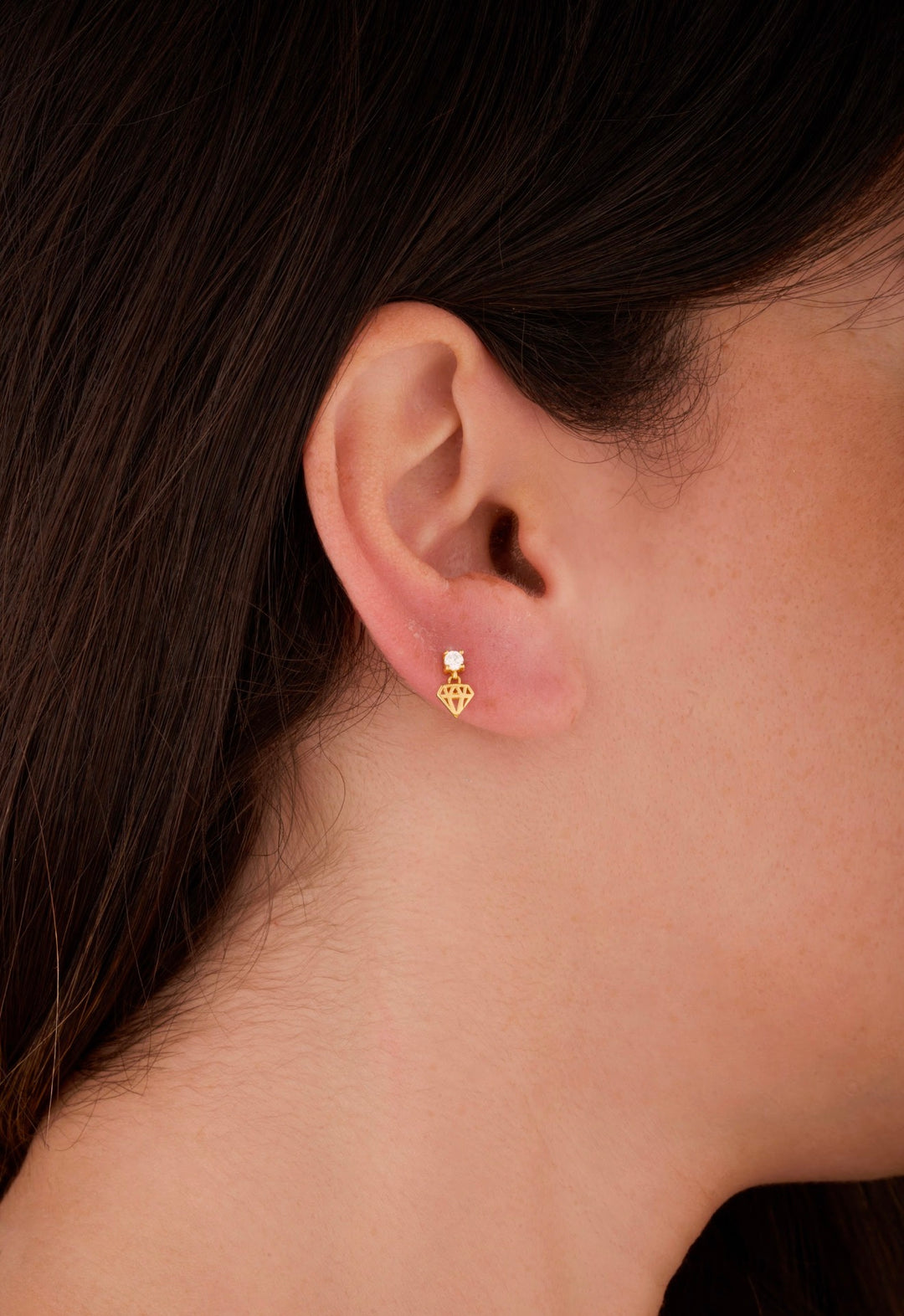 Iris round stone with jewel gold ear piercing