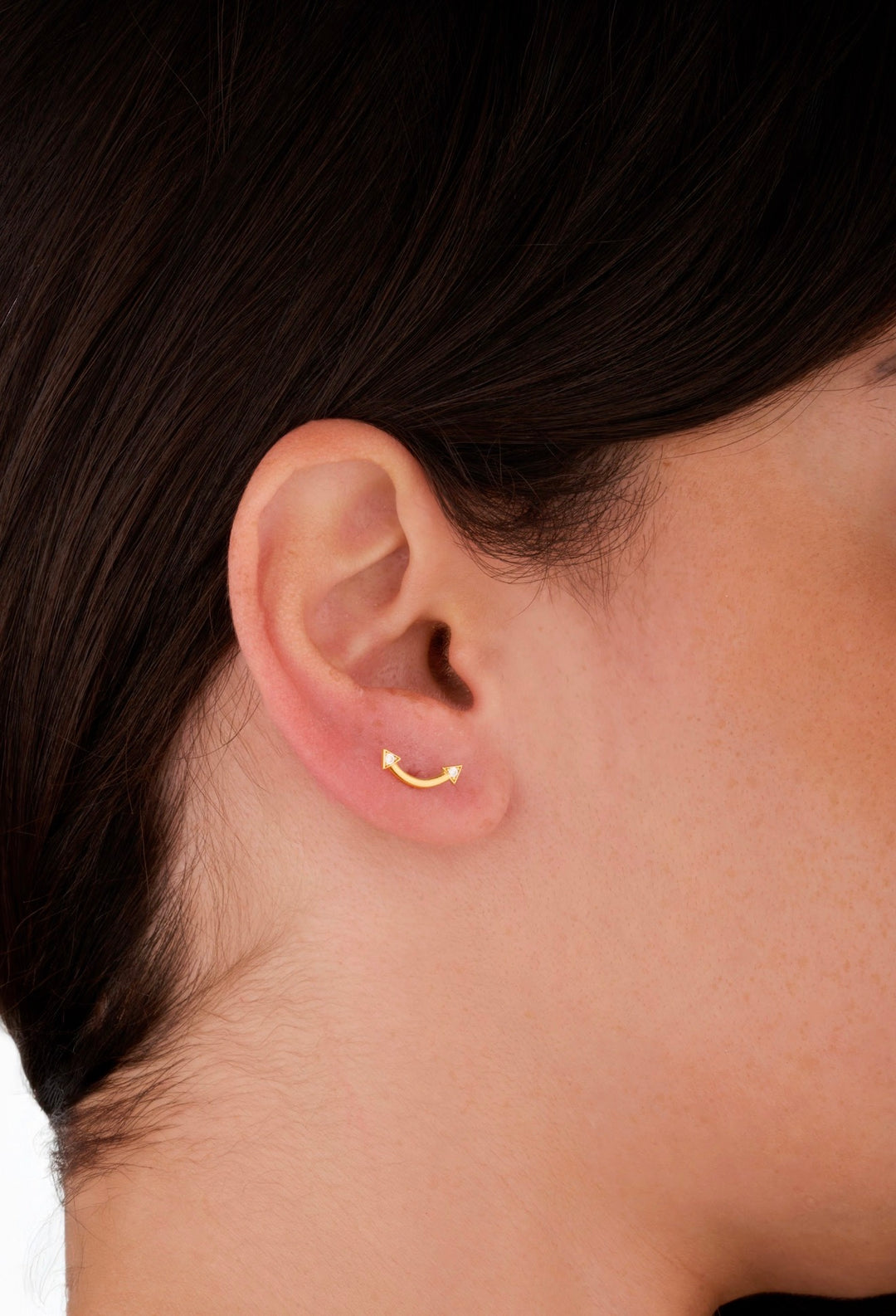 Iris gold curved arrow ear piercing