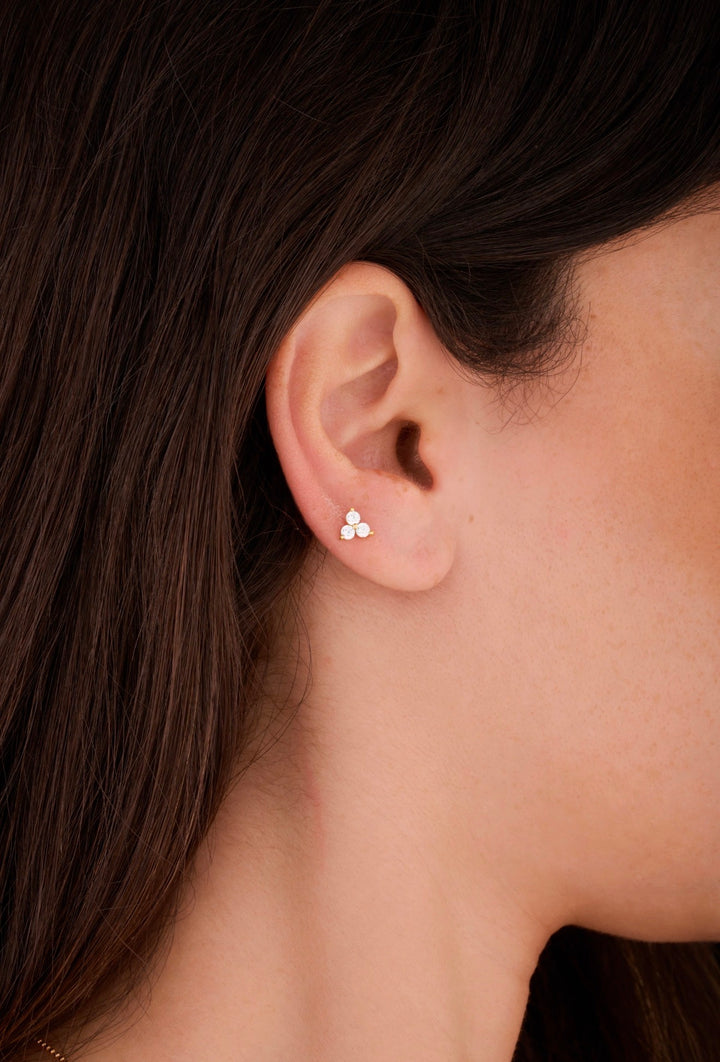 Iris gold ear piercing