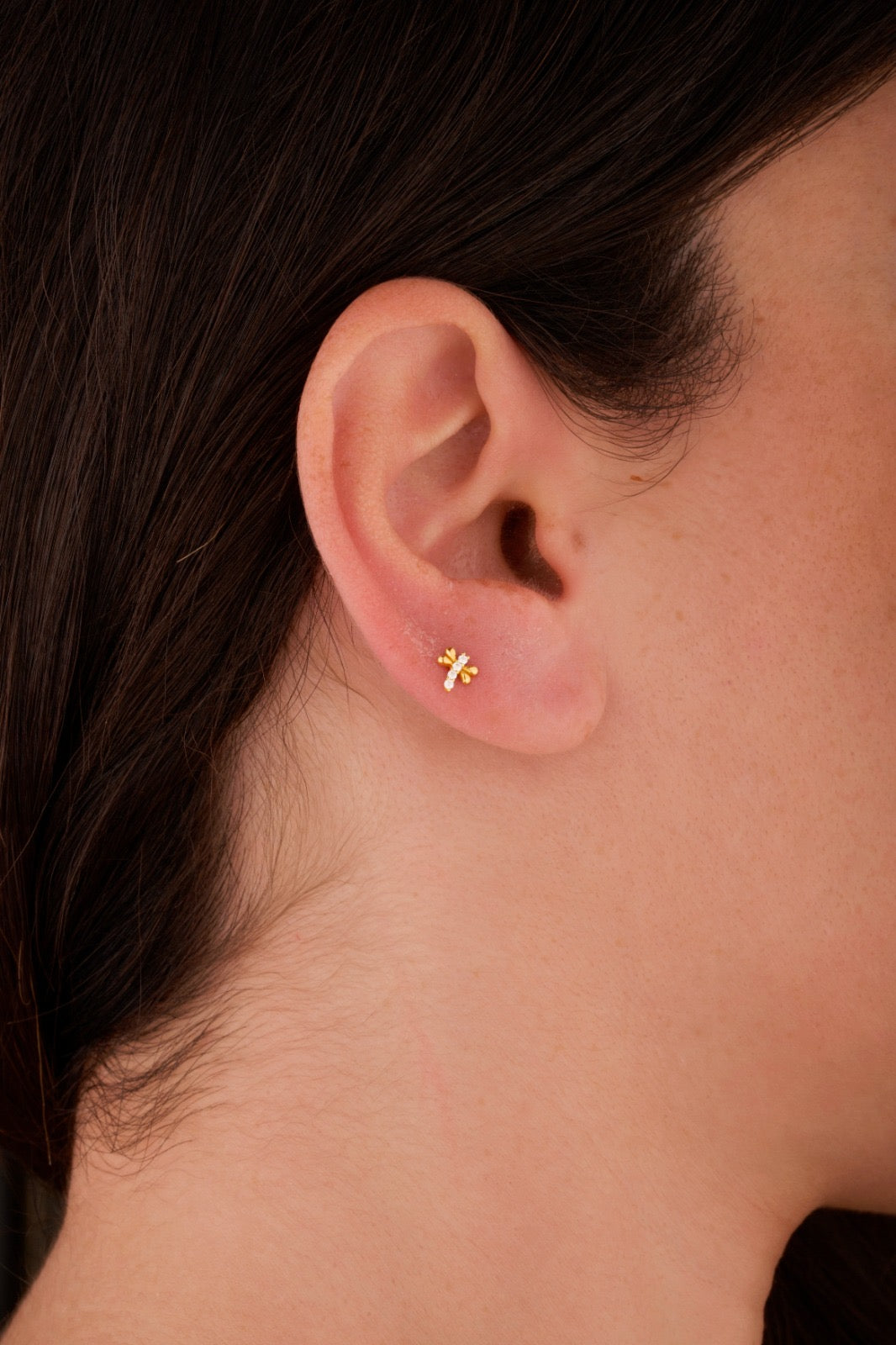 Iris fly gold ear piercing