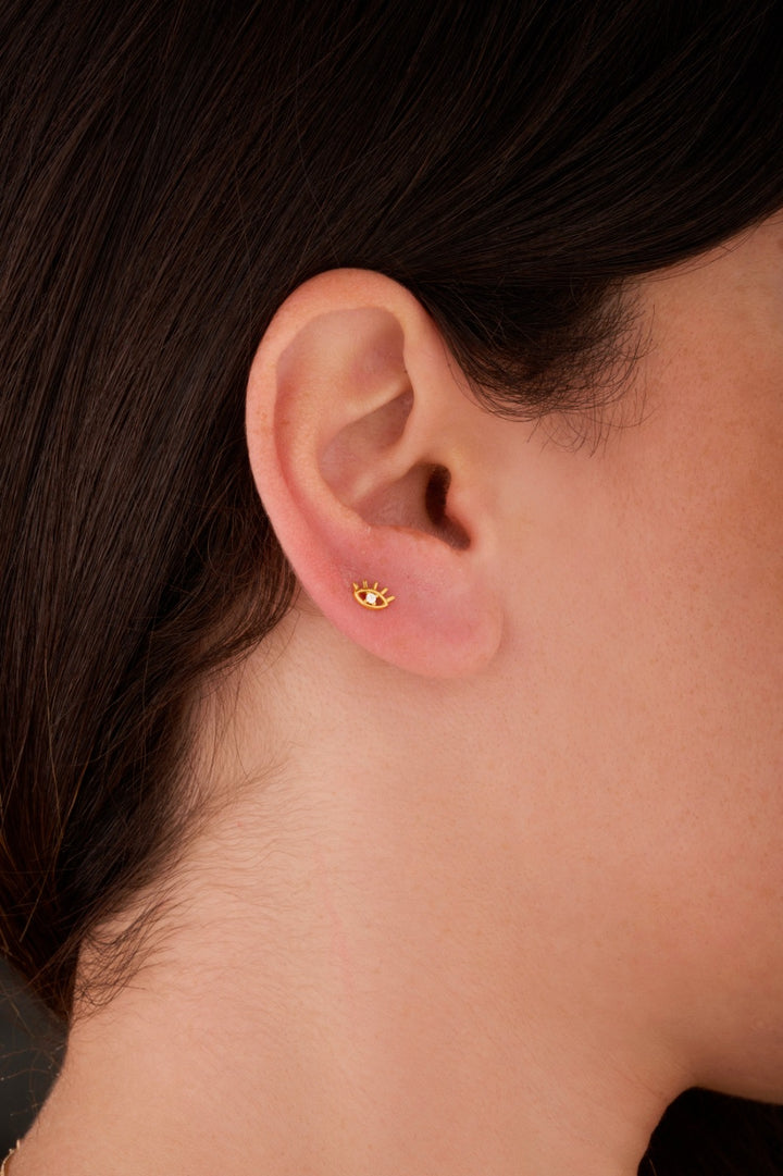 Iris eye gold ear piercing