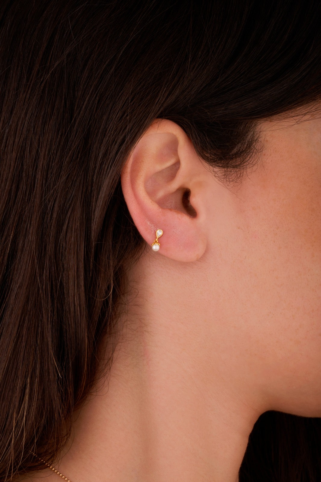 Iris pair with pearl ear piercing