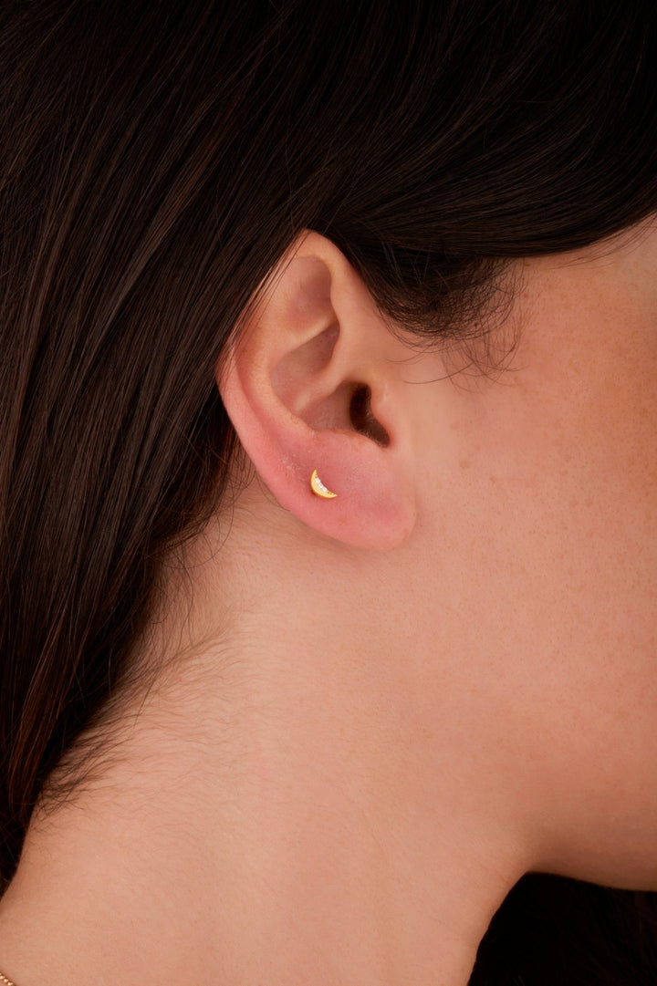 Iris moon gold ear piercing