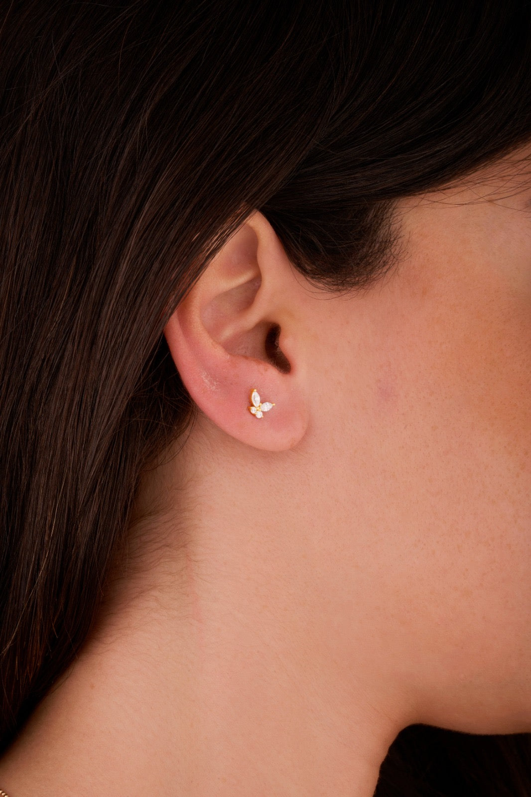 Iris butterfly gold ear piercing