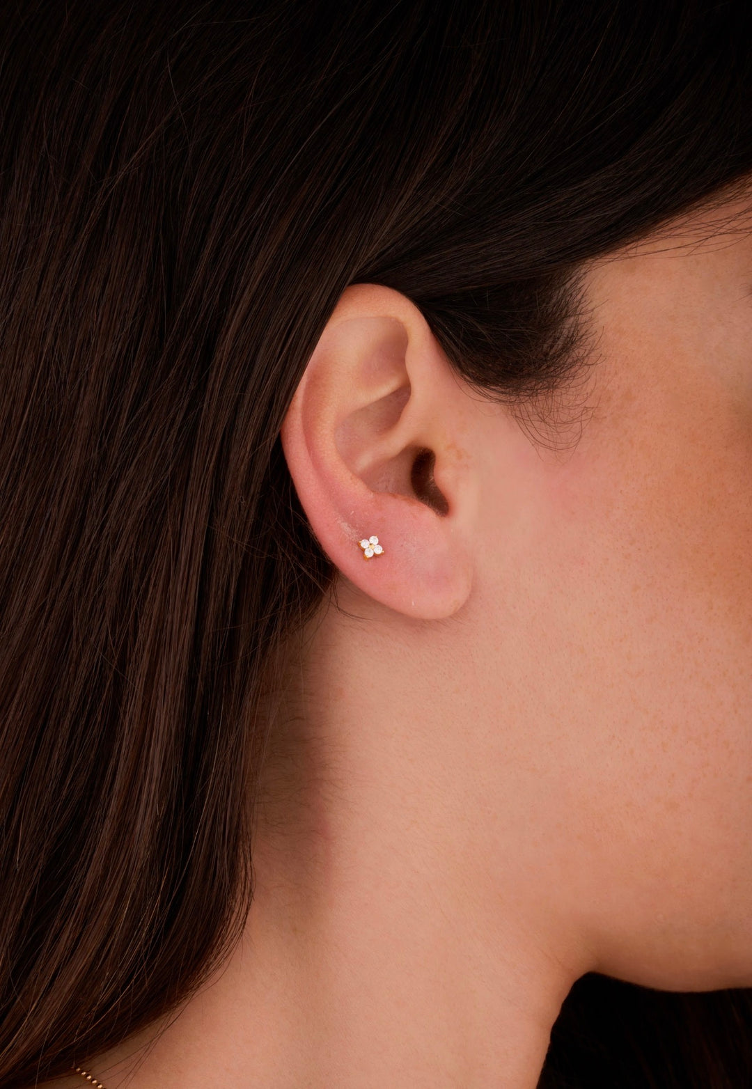 Iris clover gold ear piercing