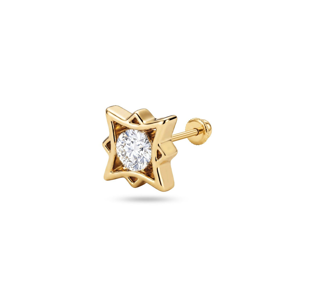 Iris gold ear piercing